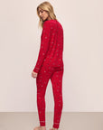 Model wears the Gisele Printed TENCEL™ Modal Crewneck PJ Set in Winter Wonderland Haute Red/Ivory.