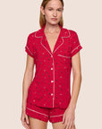 Model is wearing Gisele Printed TENCEL™ Modal Shortie Short PJ Set  in Nutcracker Holly Red/Ivory