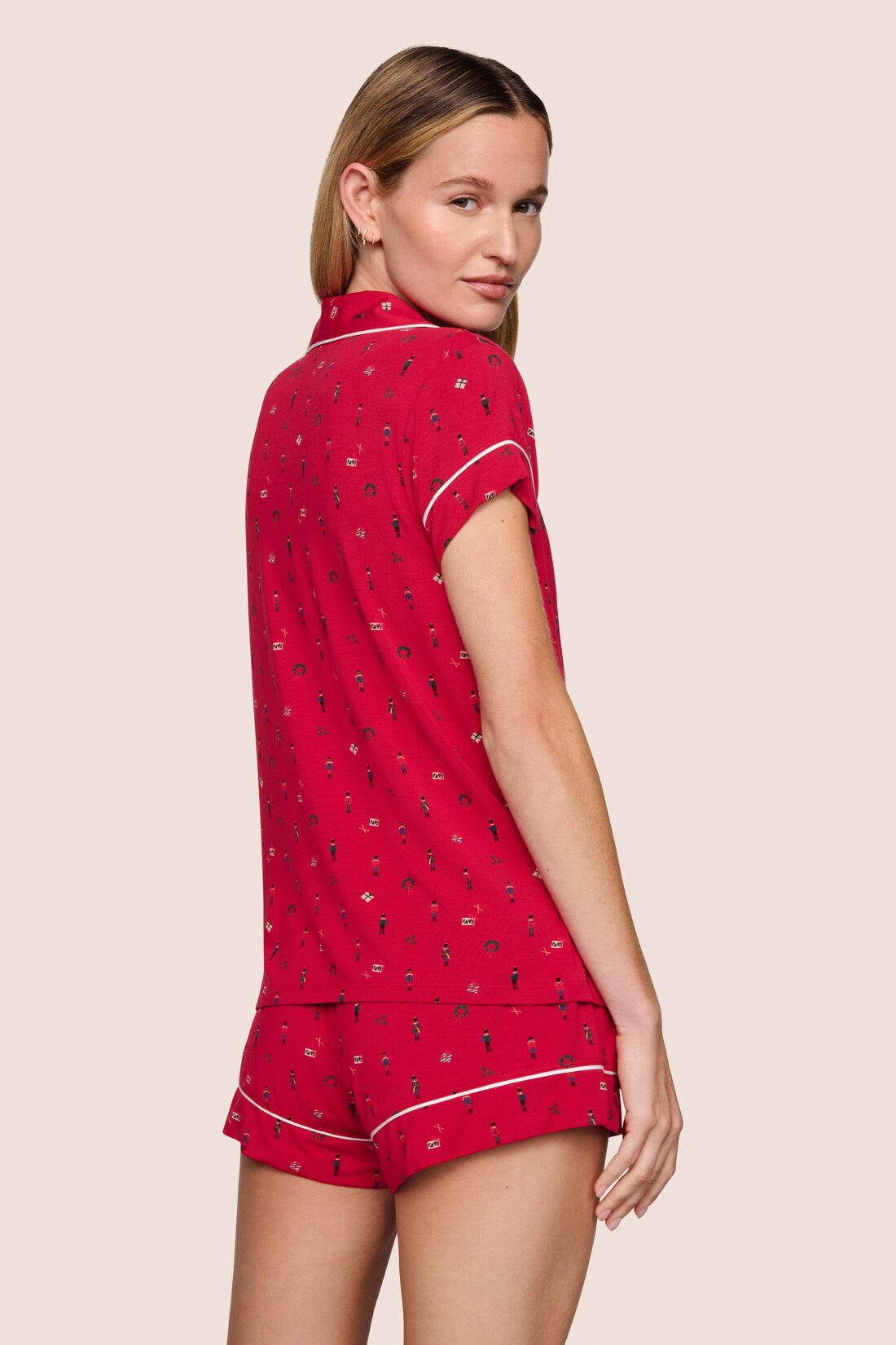 Model is wearing Gisele Printed TENCEL™ Modal Shortie Short PJ Set  in Nutcracker Holly Red/Ivory