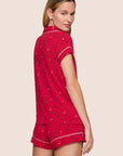 Model is wearing Gisele Printed TENCEL™ Modal Shortie Short PJ Set  in Nutcracker Holly Red/Ivory