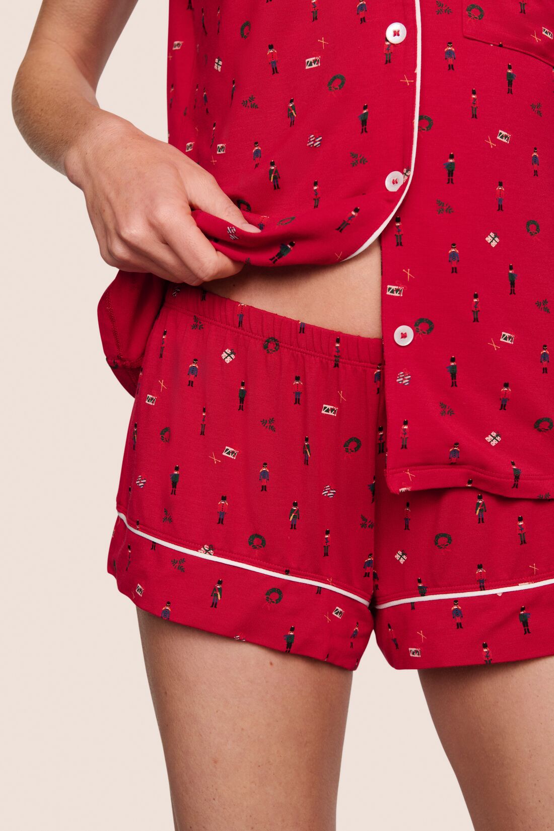 Model is wearing Gisele Printed TENCEL™ Modal Shortie Short PJ Set  in Nutcracker Holly Red/Ivory
