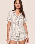 Model is wearing Gisele Printed TENCEL™ Modal Relaxed Short PJ Set  in Heart To Heart Black/Blk