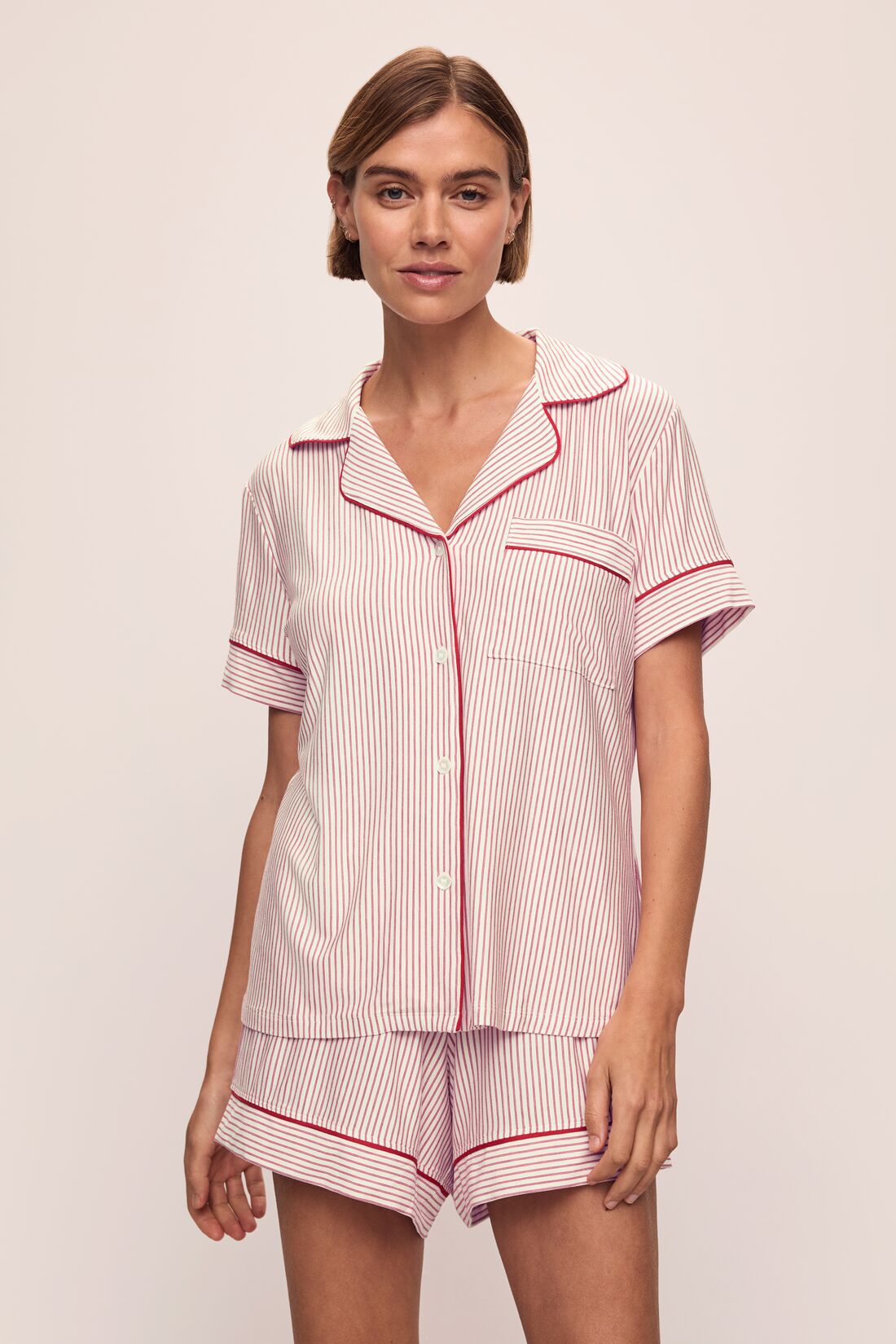 Model wears the Gisele Printed TENCEL™ Modal Relaxed Short PJ Set in Duo Stripe Haute Red/Haute Red.