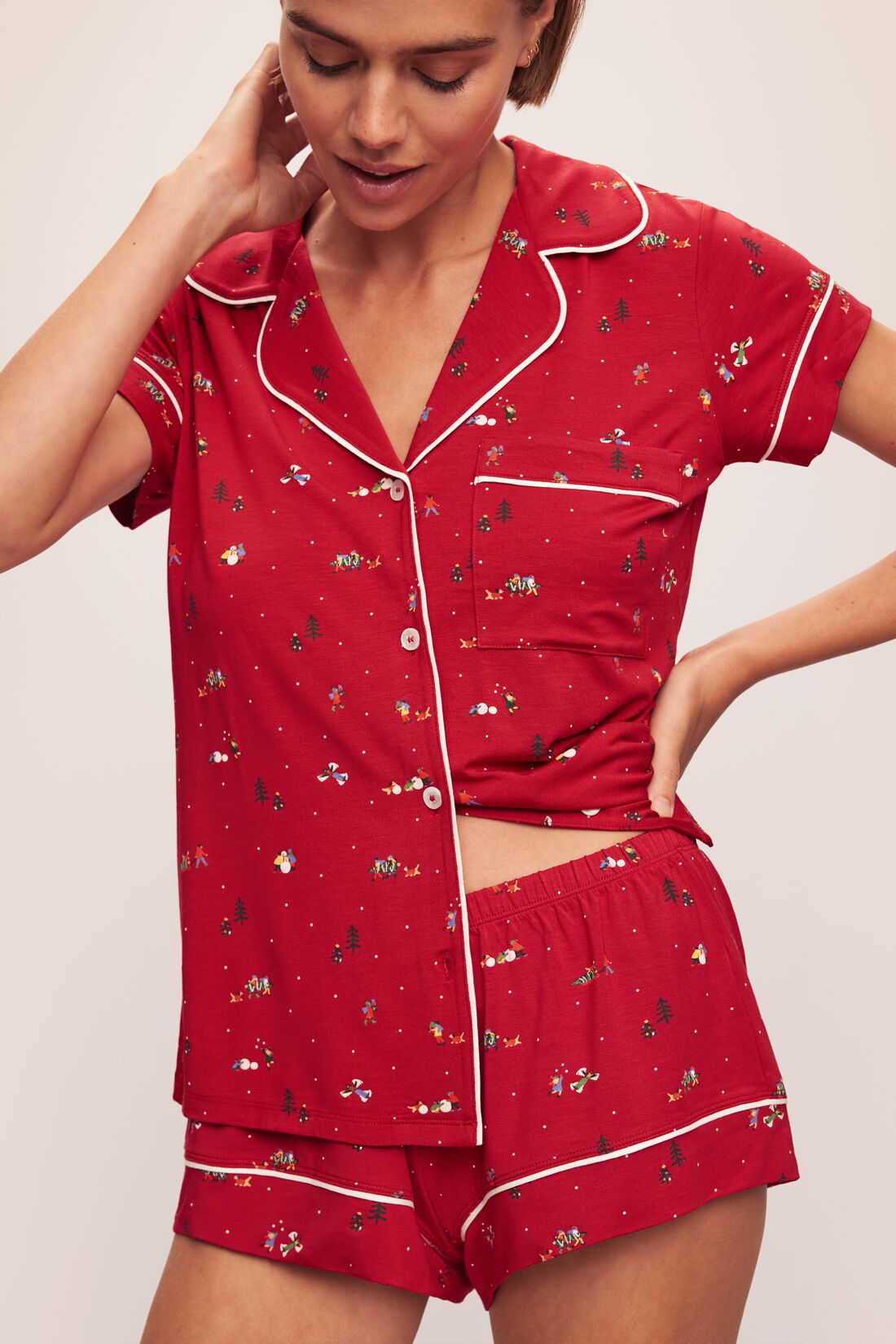 Model wears the Gisele Printed TENCEL™ Modal Shortie Short PJ Set in Winter Wonderland Haute Red/Ivory.