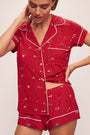 Model wears the Gisele Printed TENCEL™ Modal Shortie Short PJ Set in Winter Wonderland Haute Red/Ivory.