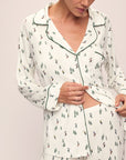 Model wears the Gisele Printed TENCEL™ Modal Long PJ Set in Alpine Skier Ivory/Forest Green.