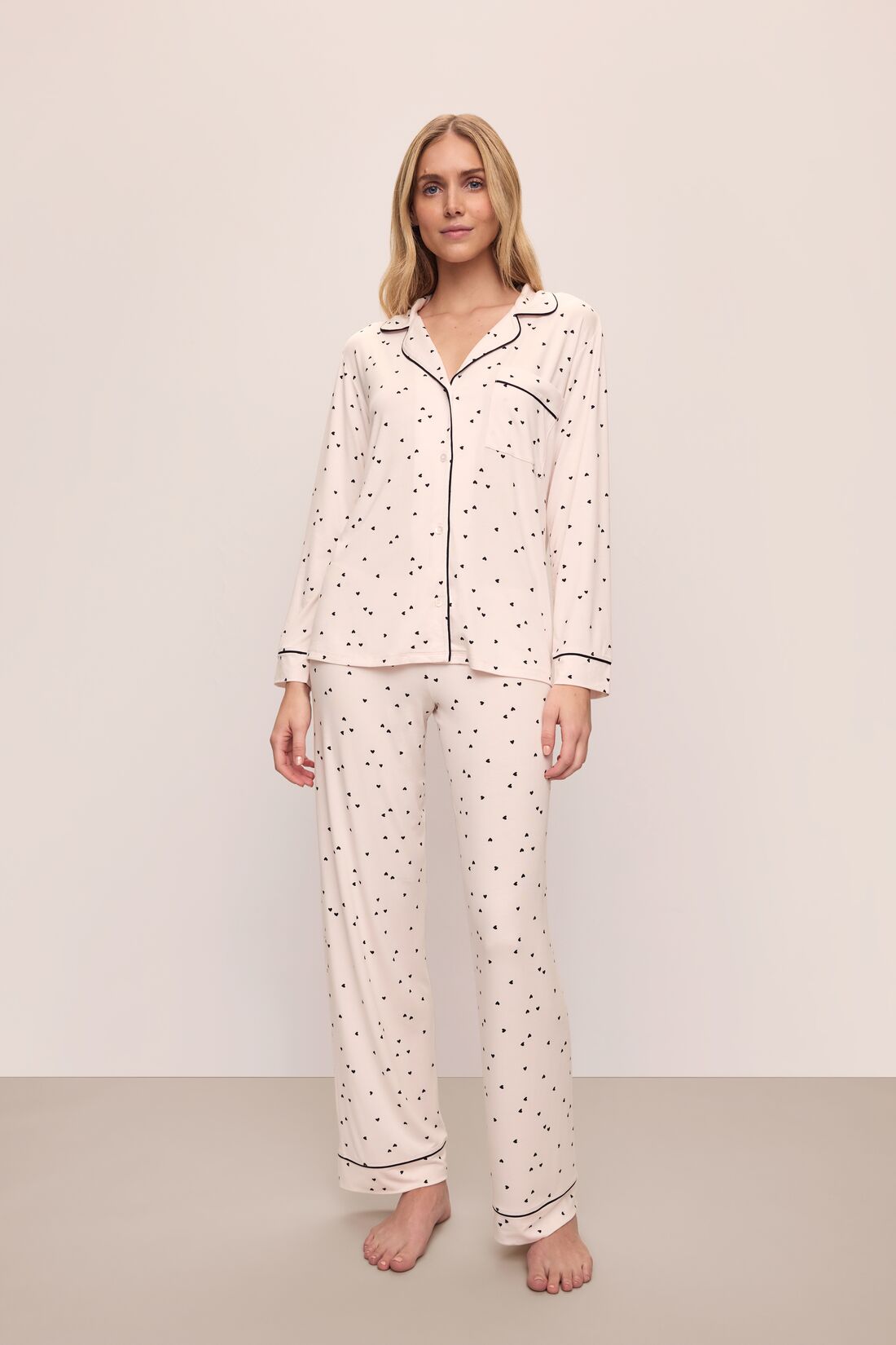 Model is wearing Gisele Printed TENCEL™ Modal Long PJ Set in Little Heart Sorbet Pink/Black 