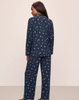 Model wears the Gisele Printed TENCEL™ Modal Long PJ Set in Woodland Pine Navy/Ivory.