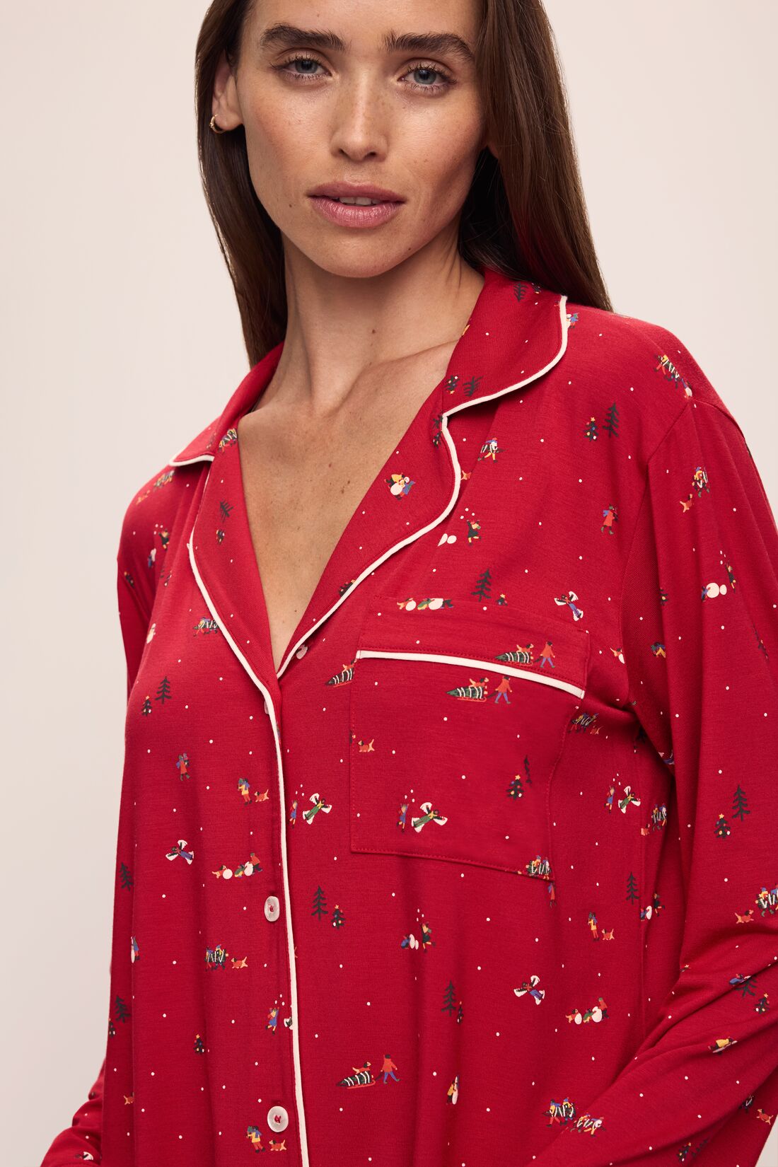 Model wears the Gisele Printed TENCEL™ Modal Long PJ Set in Winter Wonderland Haute Red/Ivory.