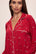 Model wears the Gisele Printed TENCEL™ Modal Long PJ Set in Winter Wonderland Haute Red/Ivory.