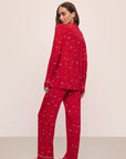 Model wears the Gisele Printed TENCEL™ Modal Long PJ Set in Winter Wonderland Haute Red/Ivory.