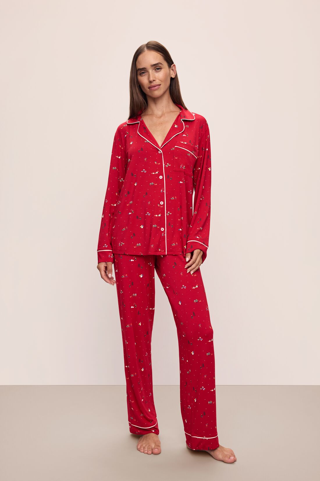 Model wears the Gisele Printed TENCEL™ Modal Long PJ Set in Winter Wonderland Haute Red/Ivory.