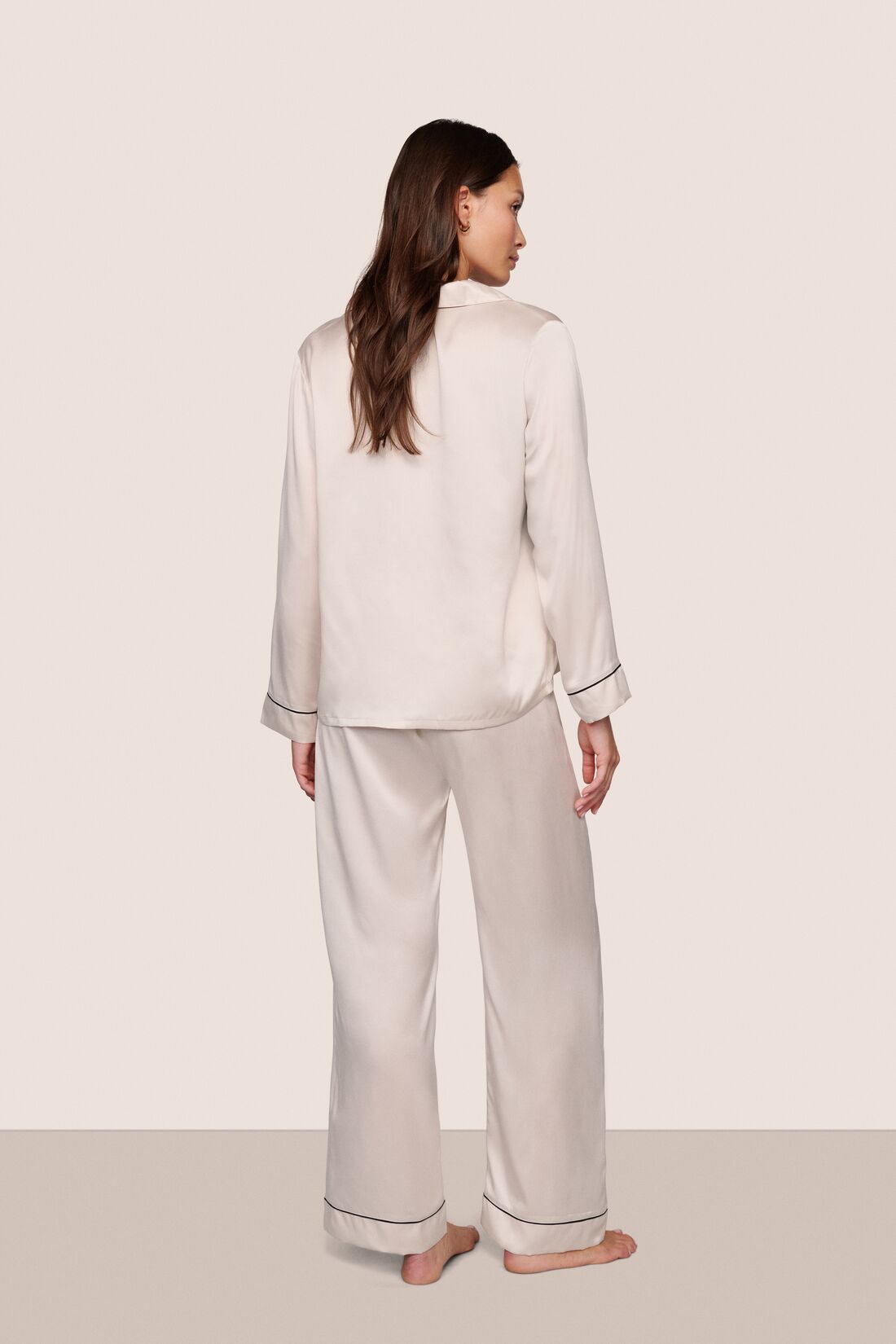 Model wearing Inez Washable Silk Long PJ Set in Heart to Silver Pink/Black