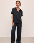 Model wears Inez Washable Silk Short Sleeve Pant PJ Set in Black/Champagne.