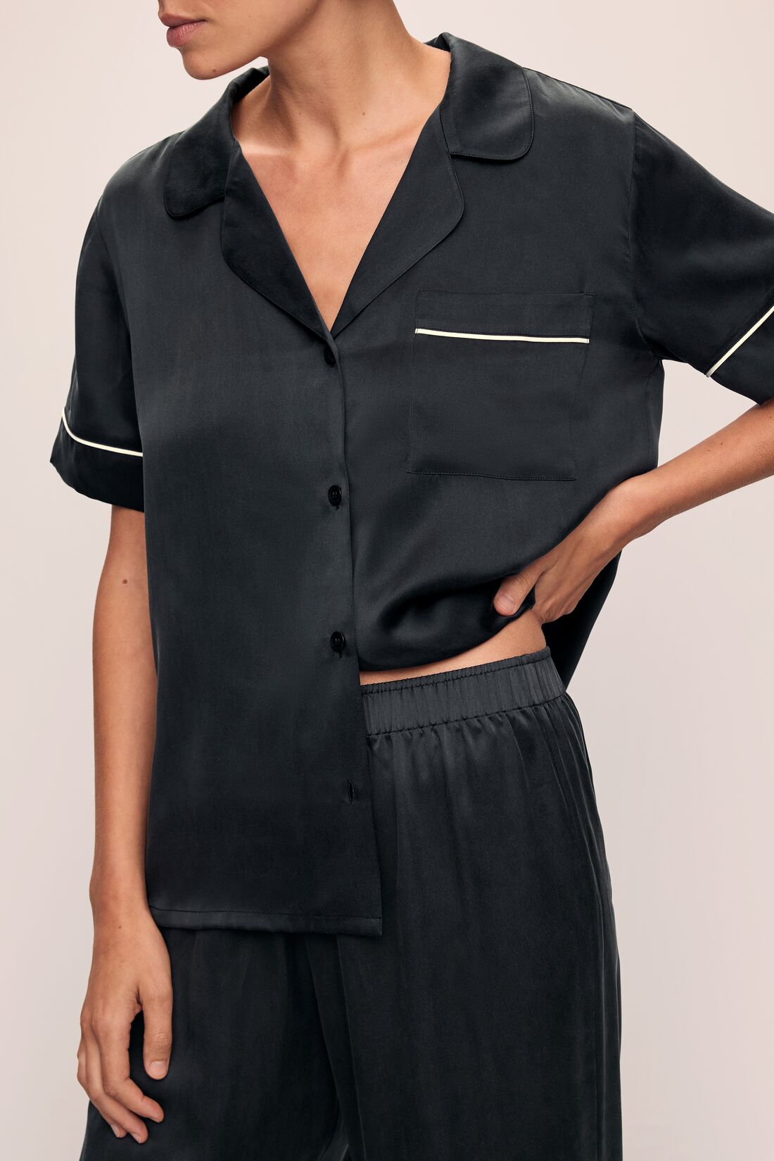 Model wears Inez Washable Silk Short Sleeve Pant PJ Set in Black/Champagne.