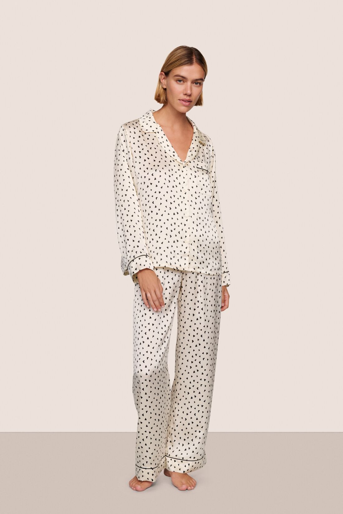 Model wearing Inez Washable Silk Printed Long PJ Set in Heart to Heart Black/Black