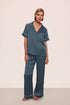 Model is wearing Inez Washable Silk Printed Short Sleeve Pant PJ Set in Petite Batik Navy/Ivory