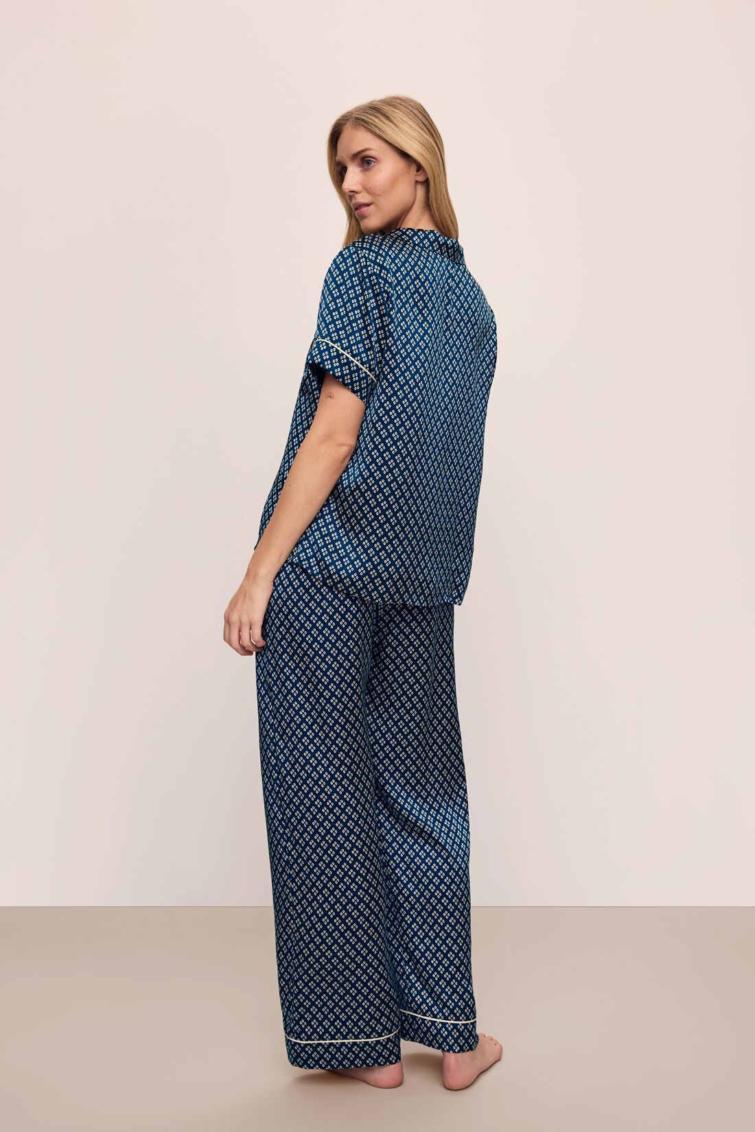 Model wears Inez Washable Silk Printed Short Sleeve Pant PJ Set in Petite Batik Indigo/Bone.