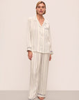 Model is wearing Inez Washable Silk Printed Long Pj Set in Serene Stripe Navy/Navy