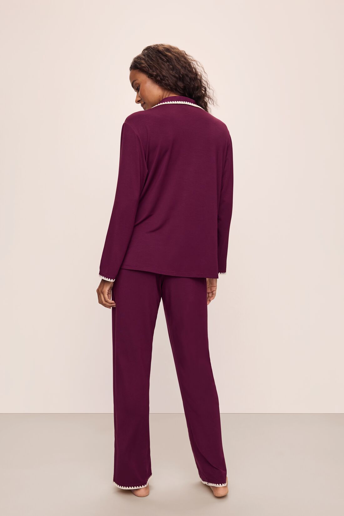 Model wears Frida TENCEL™ Modal Long PJ Set in Plum/Ivory.