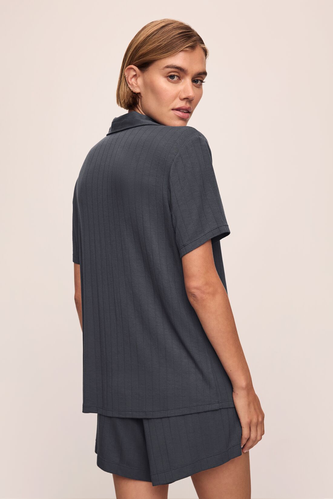 Model wears Gisele TENCEL™ Modal Rib Relaxed Short PJ Set in Graphite.