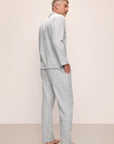 Model is wearing Men's Flannel Long PJ Set in Wintercheck Heather Grey/Ivory.