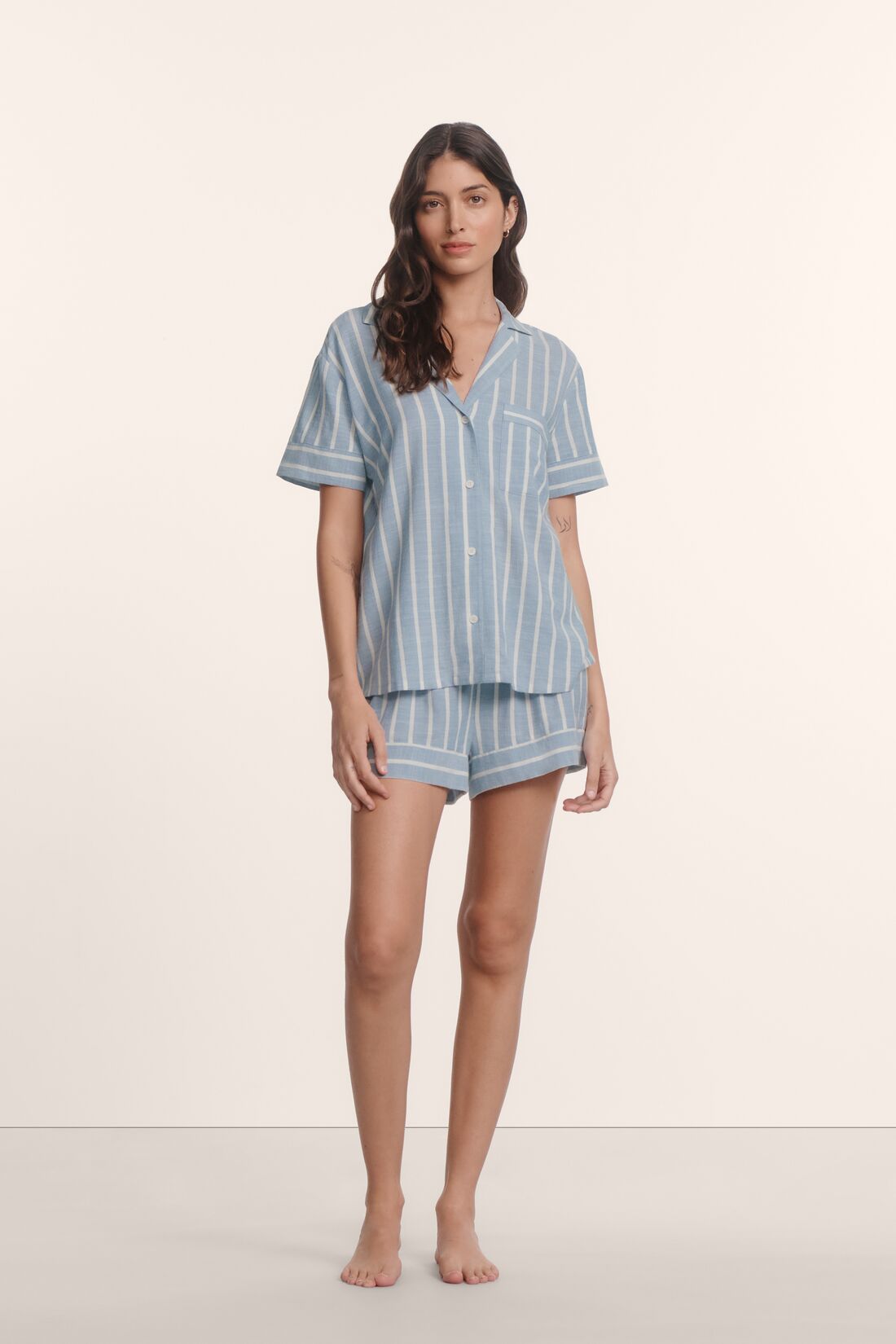 Model is wearing Nautico Shortie Short PJ Set in Classic Stripe Slate Blue/Ivor
