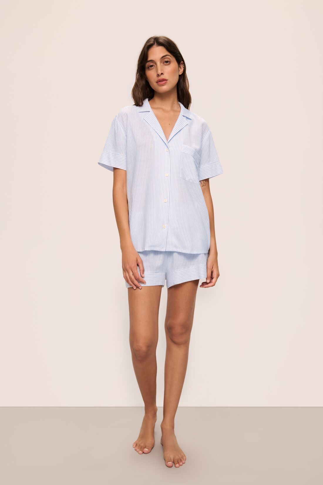 Model is wearing Nautico Shortie Short PJ Set in White/Cornflower Blue