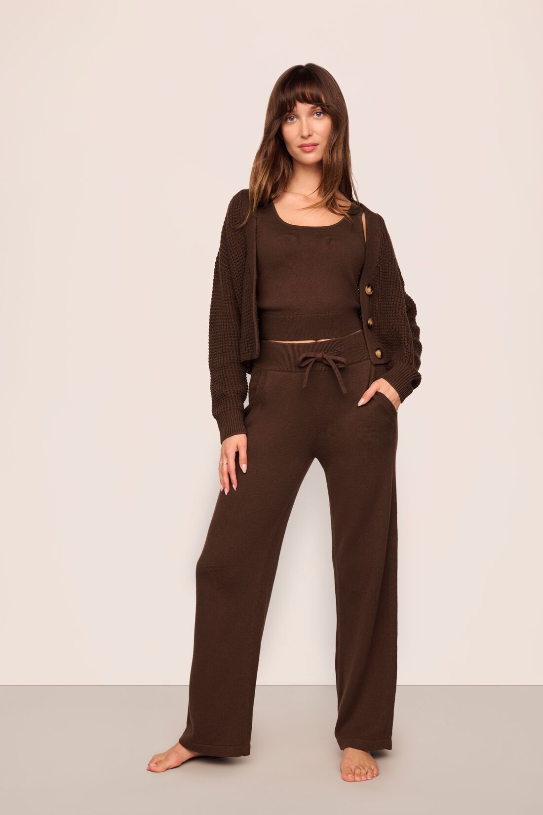 Model is wearing Recycled Sweater Cardigan in  Chocolate
