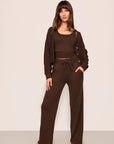 Model is wearing Recycled Sweater Cardigan in  Chocolate