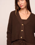 Model is wearing Recycled Sweater Cropped Cardigan  in  Chocolate