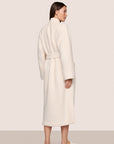 Model is wearing Renew Plush Long Robe  in Ivory