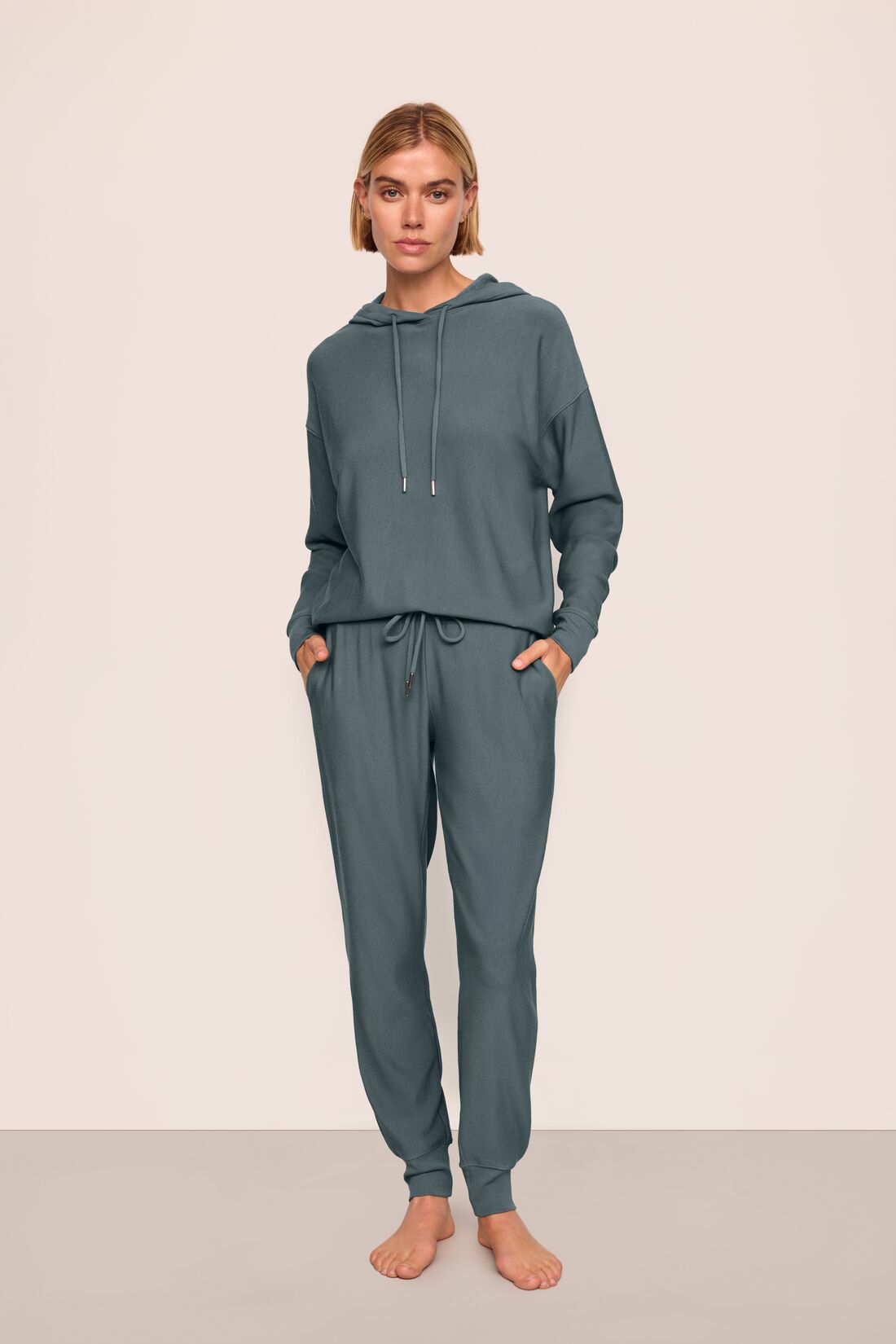 Model is wearing Softest Sweats Hoodie and Jogger in Stone Blue