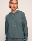 Model is wearing softest sweats hoodie in stone blue