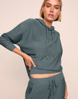 Model is wearing softest sweats hoodie in stone blue