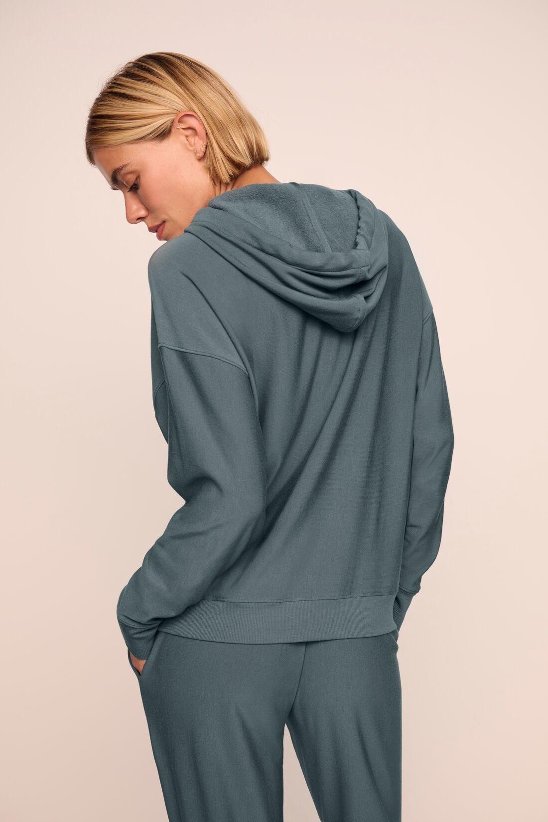 Model is wearing softest sweats hoodie in stone blue