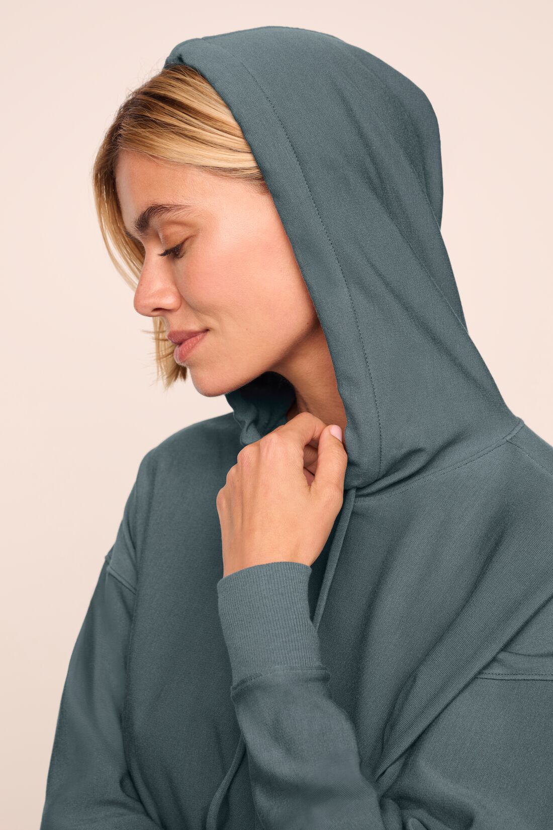 Model is wearing softest sweats hoodie in stone blue