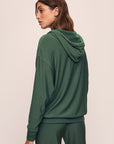 Model wears Softest Sweats Hoodie in Spruce.