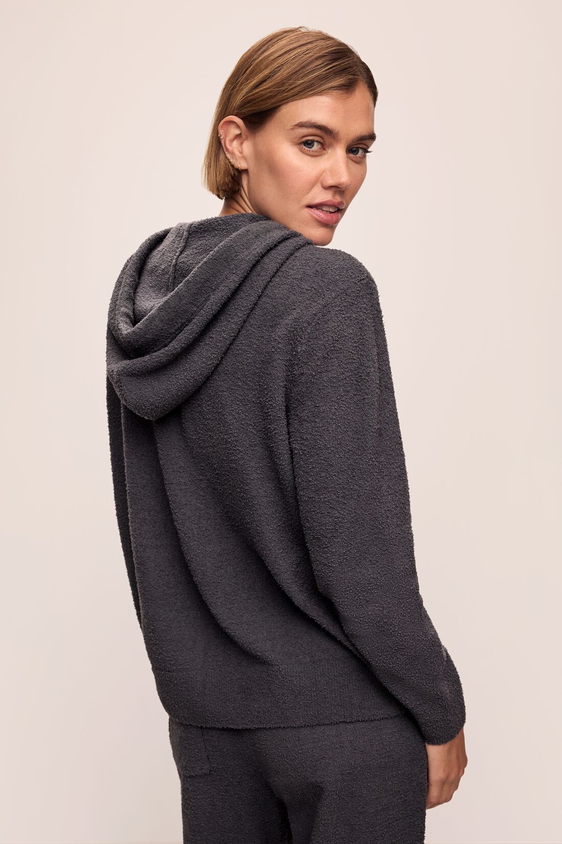 Model in Recycled Boucle Women&#39;s Hoodie and Jogger in Graphite