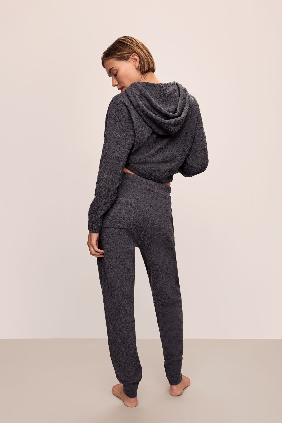 Model in Recycled Boucle Women&#39;s Hoodie and Jogger in Graphite