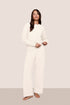 Model wearing recycled boucle pant in ivory