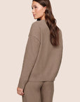 Model is wearing Recycled Boucle Crew Neck Pullover  in Deep Taupe