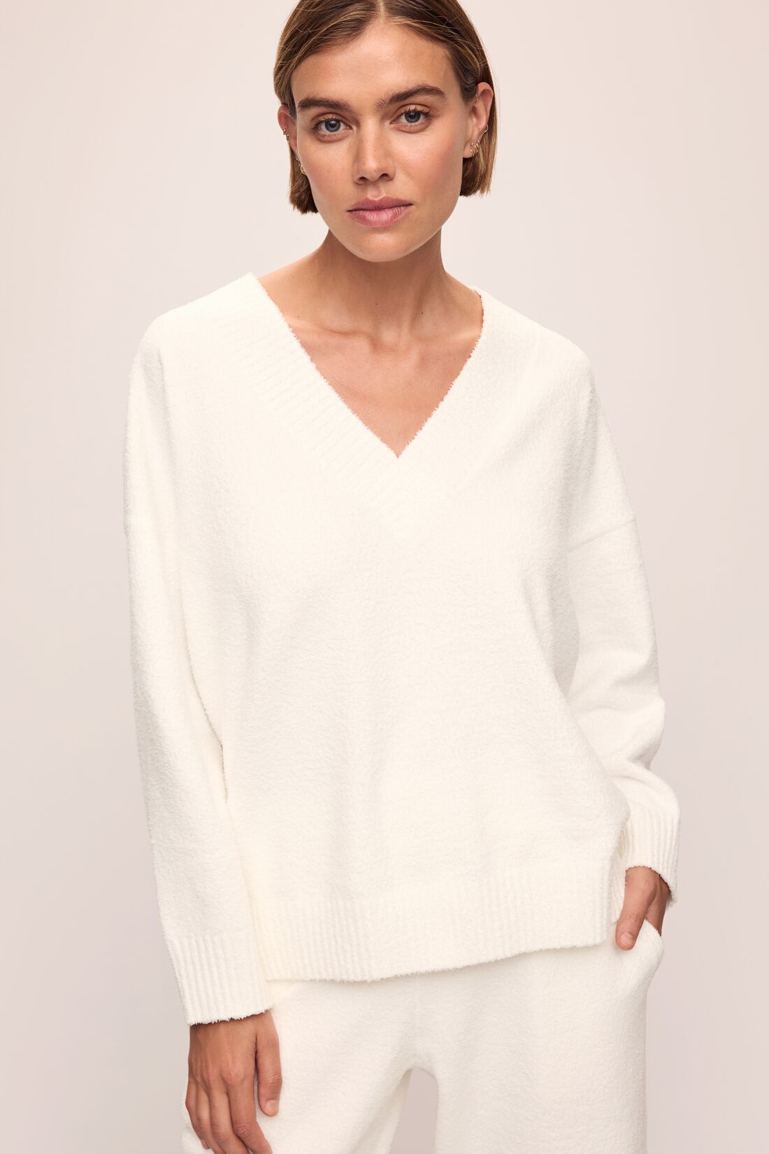 Model in Recycled Boucle Oversized V-neck Sweater and Relaxed Fit Pant in Ivory