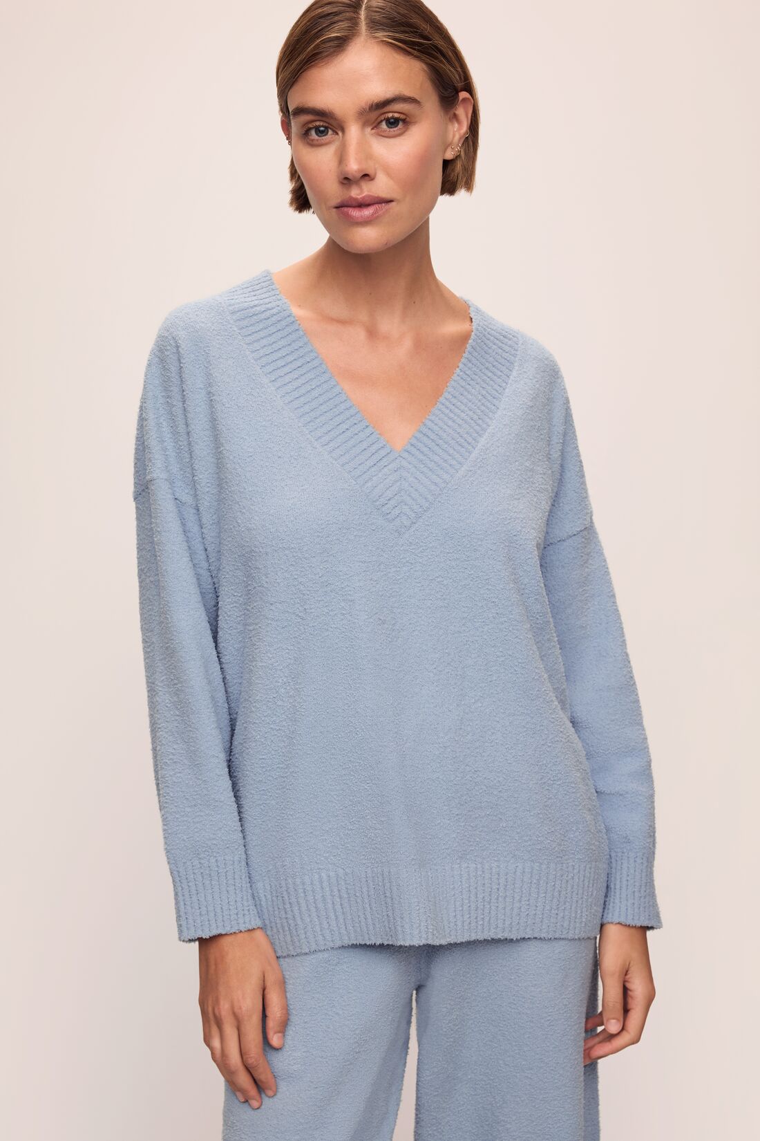 Model in Recycled Boucle Oversized V-neck Sweater and Relaxed Fit Pant in Wedgewood