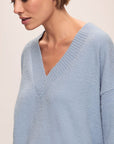 Model in Recycled Boucle Oversized V-neck Sweater in Wedgewood