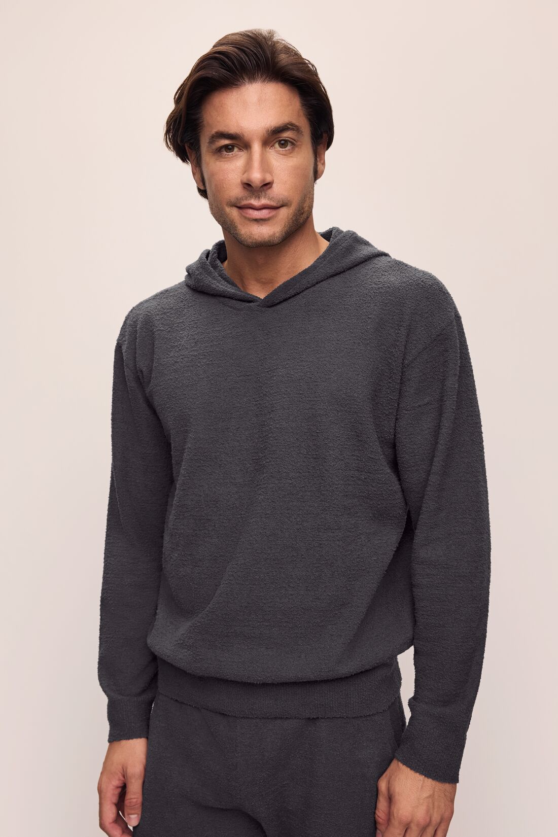 Model is wearing Men&#39;s Recycled Boucle Hoodie in Graphite.