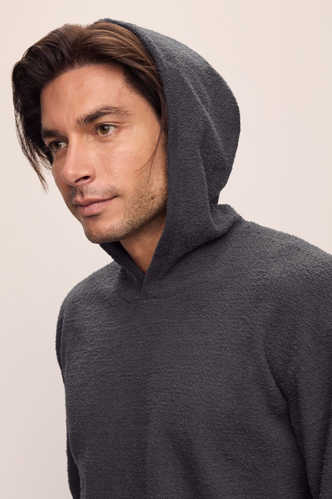 Model is wearing Men's Recycled Boucle Hoodie in Graphite.