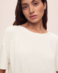 Model wears Gisele TENCEL™ Modal Everyday T-Shirt in ivory.