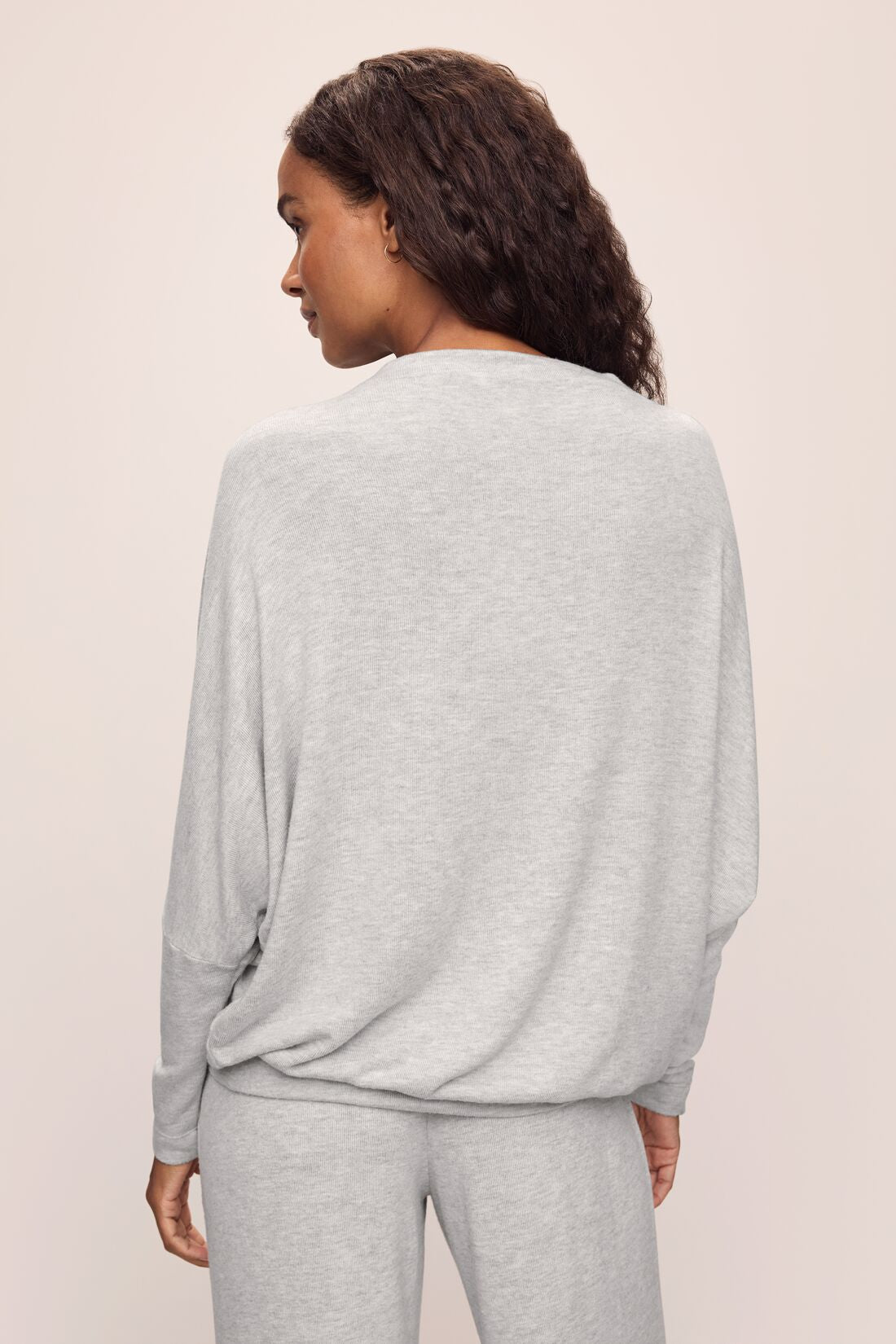 Model wears Cozy Time Mock Neck Pullover in Lt. Heather Grey.