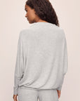 Model wears Cozy Time Mock Neck Pullover in Lt. Heather Grey.